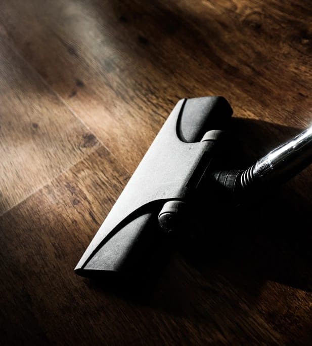 Vacuum cleaner on a wooden floor