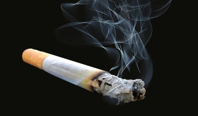Cigarette smoke curling in the air
